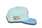 Blue suede snapback hat.