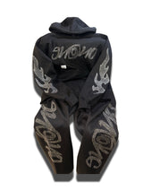 Black Enono rhinestone jumpsuit.