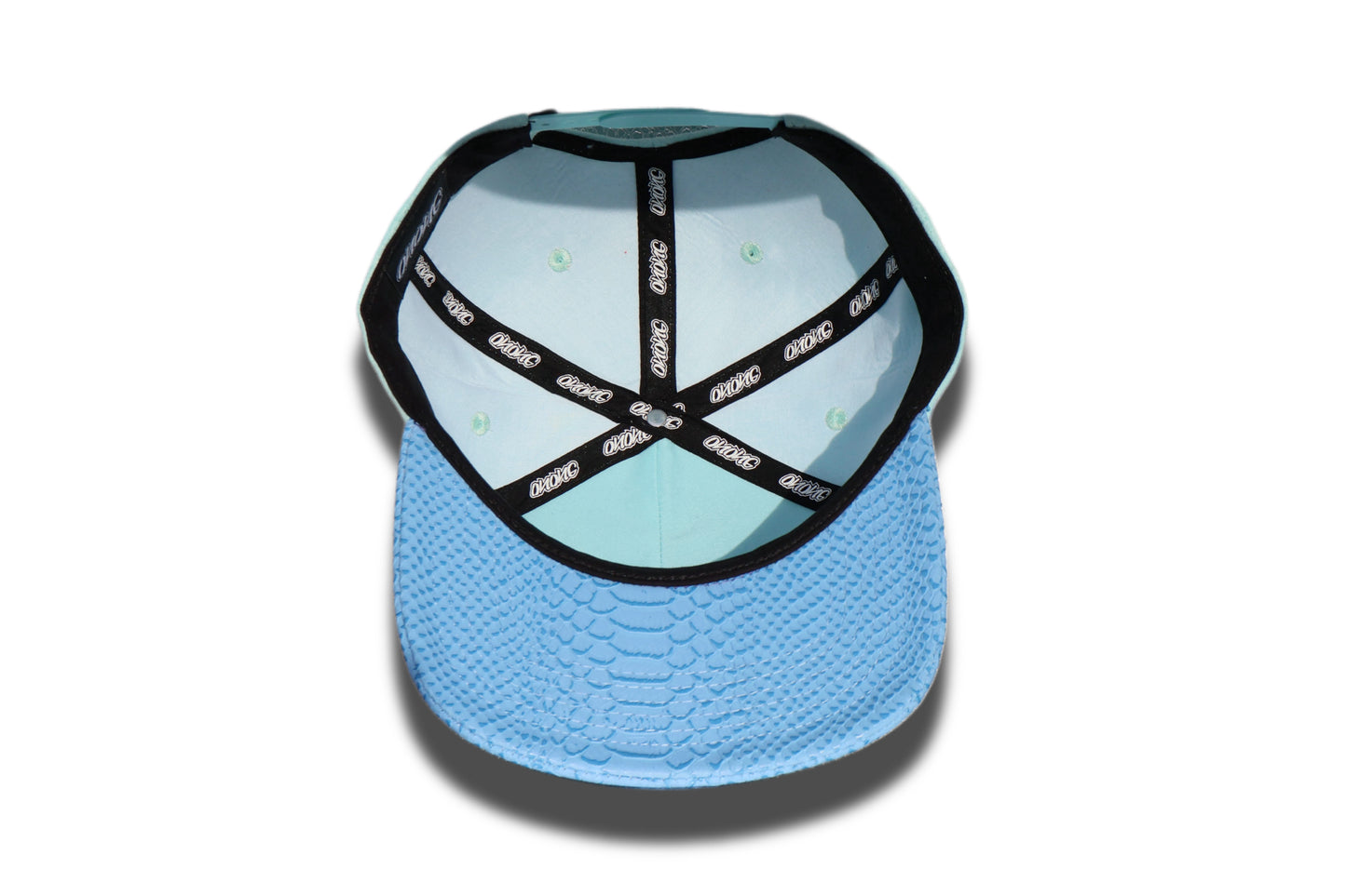 Blue suede snapback hat.