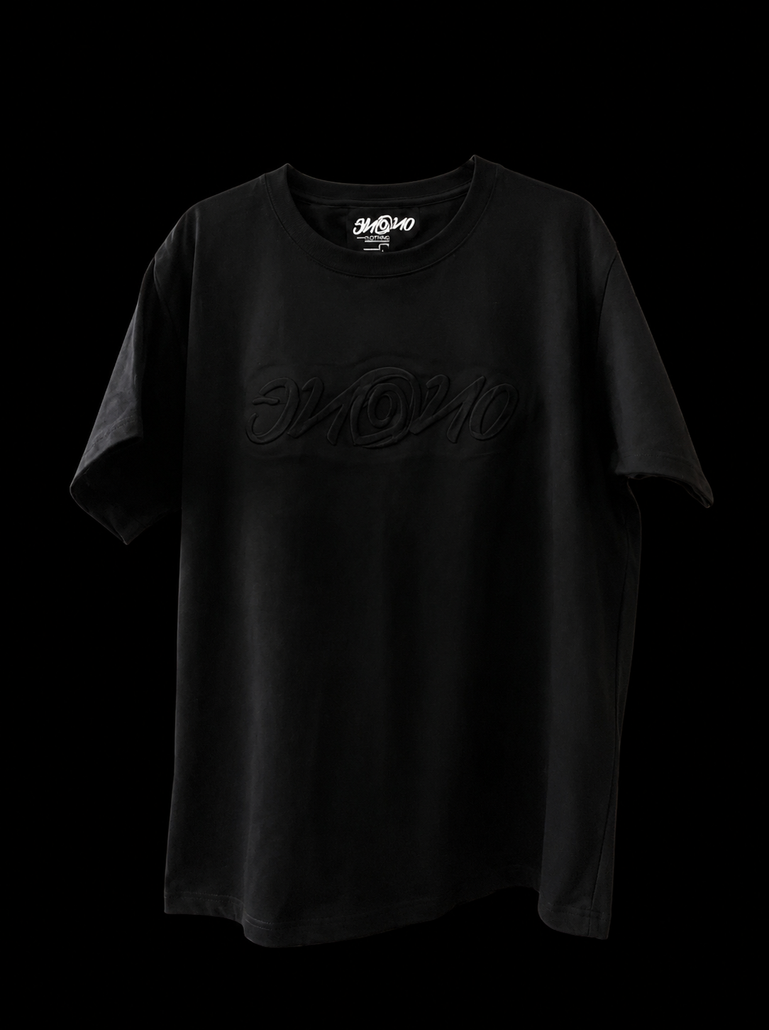 Black embossed t-shirt.